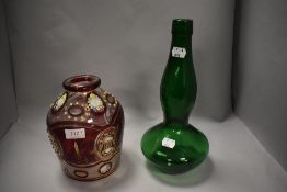 A Victorian ruby glass receptacle having gilt heightening and floral decoration and a green glass