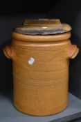 A floor standing salt glazed stone ware grain or flour bin with a Beech wood lid. 35cm tall