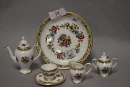 A miniature Coalport cabinet display or dolls house tea service.