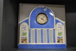 A large continental Art Deco ceramic mantel clock of architectural design in white and blue with