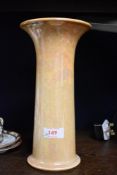 A 1923 dated Ruskin vase of fluted tubular shape, having peach lustre glaze.