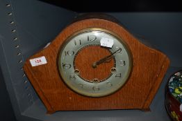 An early 20th century oak case mantel clock with Westminster chime.