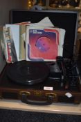 A modern USB Turntable record player with a selection of 75rpm singles.