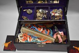 A Japanese lacquer jewellery case with a selection of yellow and white metal ear rings and