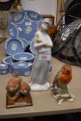 Three figure studies including a Goebel Robin, Armarni wrens and Lladro style lady.