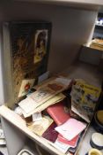 A selection of early 20th century ephemera including vintage packaging, decoupage book and autograph