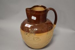 An early 20th century Doulton Lambeth harvest scene jug 22cm tall, small chip to rim.