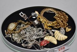 Costume jewellery including yellow metal bangles, a Roamer watch and white metal earrings.