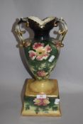 A Victorian mantel vase with sprayed floral design glaze.