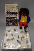 A selection of Robertson jam advertising figures and enamel pin badges.