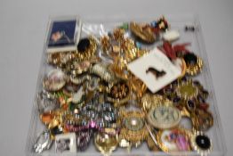 A good collection of assorted costume jewellery brooches including yellow metal, enamel and semi