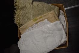 A large box of mixed vintage and retro table linen and similar.