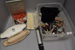 A box of assorted costume jewellery including HM silver Chinese brooches, necklaces and earrings.