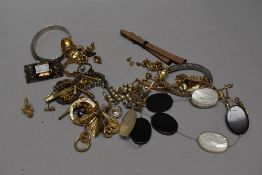A selection of yellow metal costume jewellery including earrings, necklaces and bracelets.