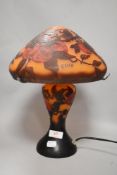 A modern orange and red glass mushroom form table lamp decorated with peaches. Bearing name Galle to