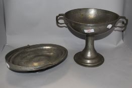 An early 20th century Arts and Crafts style Lloyd Payne planished pewter footed fruit bowl with twin