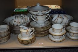 A partial dinner service having gilt accents to white ground,to be included are cups, saucers,