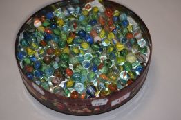 A collection of early 20th century glass marbles.