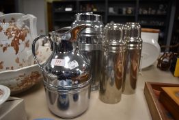 2 large Thermos flasks and two similar Universal chrome plated flasks.