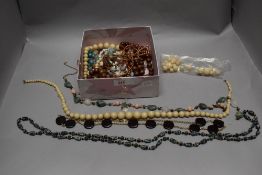 Costume jewellery including necklaces including wooden beads, plastic and precious minerals.