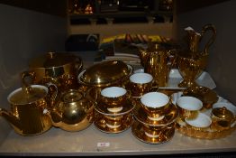 A selection of tea and dinner wares having a gilt glaze, including Royal Worcester