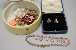 A vintage Opal effect necklace with a pair of earrings and Yellow metal necklaces.