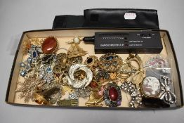 Costume jewellery including brooches, yellow metal pendants, a cameo style brooch and diamond