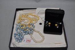Three strings of cultured baroque pearls including dyed baby blue and lemon, two pairs with matching