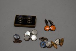 A pair of vintage yellow metal and glass maritime themed cuff-links, depicting yacht, sold