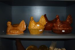 Four vintage ceramic hen and nest form egg baskets including Portmeirion and Walchester AF.