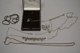A small selection of silver and white metal jewellery including marcasite necklace, butter fly