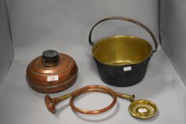 An antique brass jam pan, a copper hot water bottle and a French style horn.