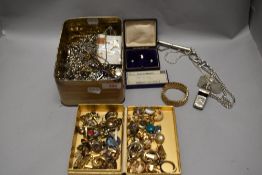 Three trays of assorted costume jewellery including yellow metal earrings and necklaces and a