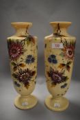 A pair of Victorian aesthetic milk glass vases, having hand painted floral designs and accented with