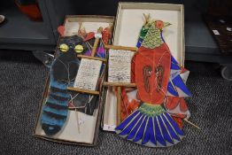 Two mid century Chinese style kites in the form of a tropical bird and a moth, both with original