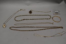A rolled gold bangle with a 14kt small necklace etc.