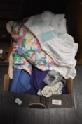 A box of ladies vintage and retro clothing, including bright 1980s blouse.