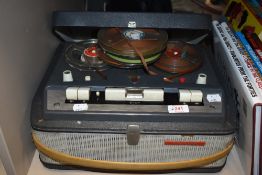A vintage Phillips reel to reel tape recorder.
