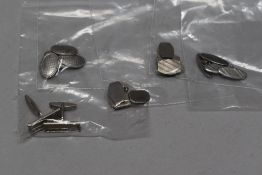 A selection of men's white metal cufflinks.