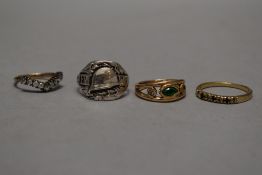 A military related silver ring marked West Wall, with three yellow metal rings.