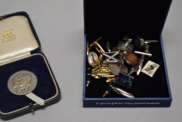 A selection of mixed men's cufflinks with a Marriage birth and Death coin.