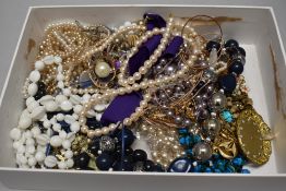 A box of assorted costume necklaces.