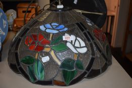 A large Tiffany style leaded light ceiling shade.