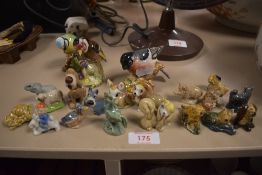 Three Beswick garden bird studies with a selection of Disney and similar Wade figures.