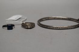 A HM silver bangle marked CH with two similar rings.