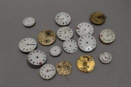A bag of antique and vintage pocket watch spare and repairs parts.