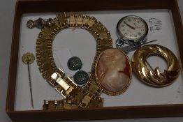 A Cameo style brooch, a Felicia nurses watch, a yellow metal necklace and Trifari brooch.