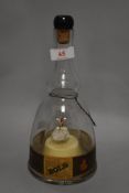 A mid century Bols ballerina decanter bottle.