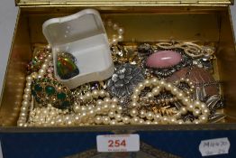 Costume jewellery including necklaces, bangles, simulated pearls and brooches.