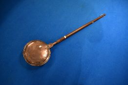 A 19th Century copper warming pan having mahogany handle